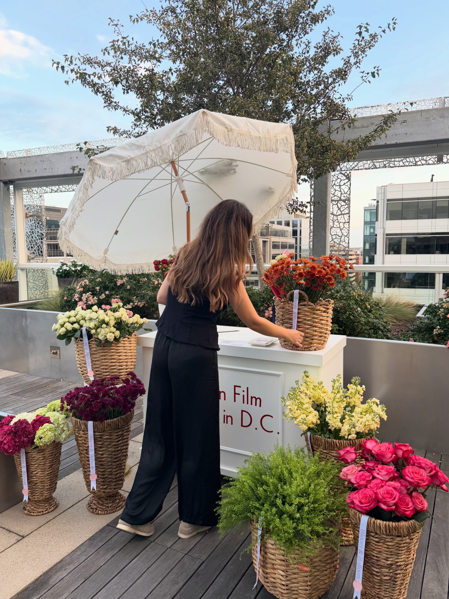 Dunja helping guests at a Bloom Bar flower experience