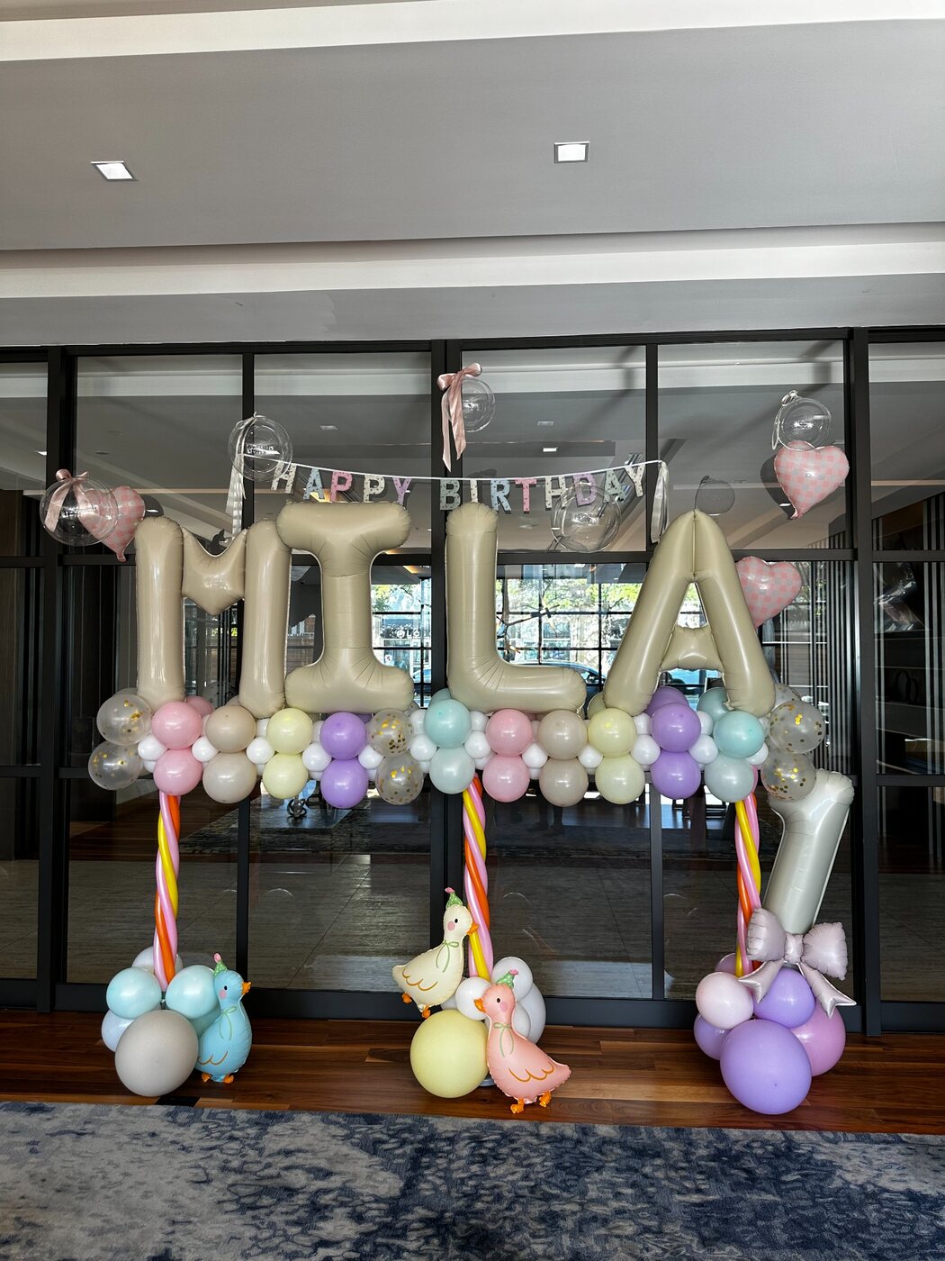 Pastel birthday balloon installation