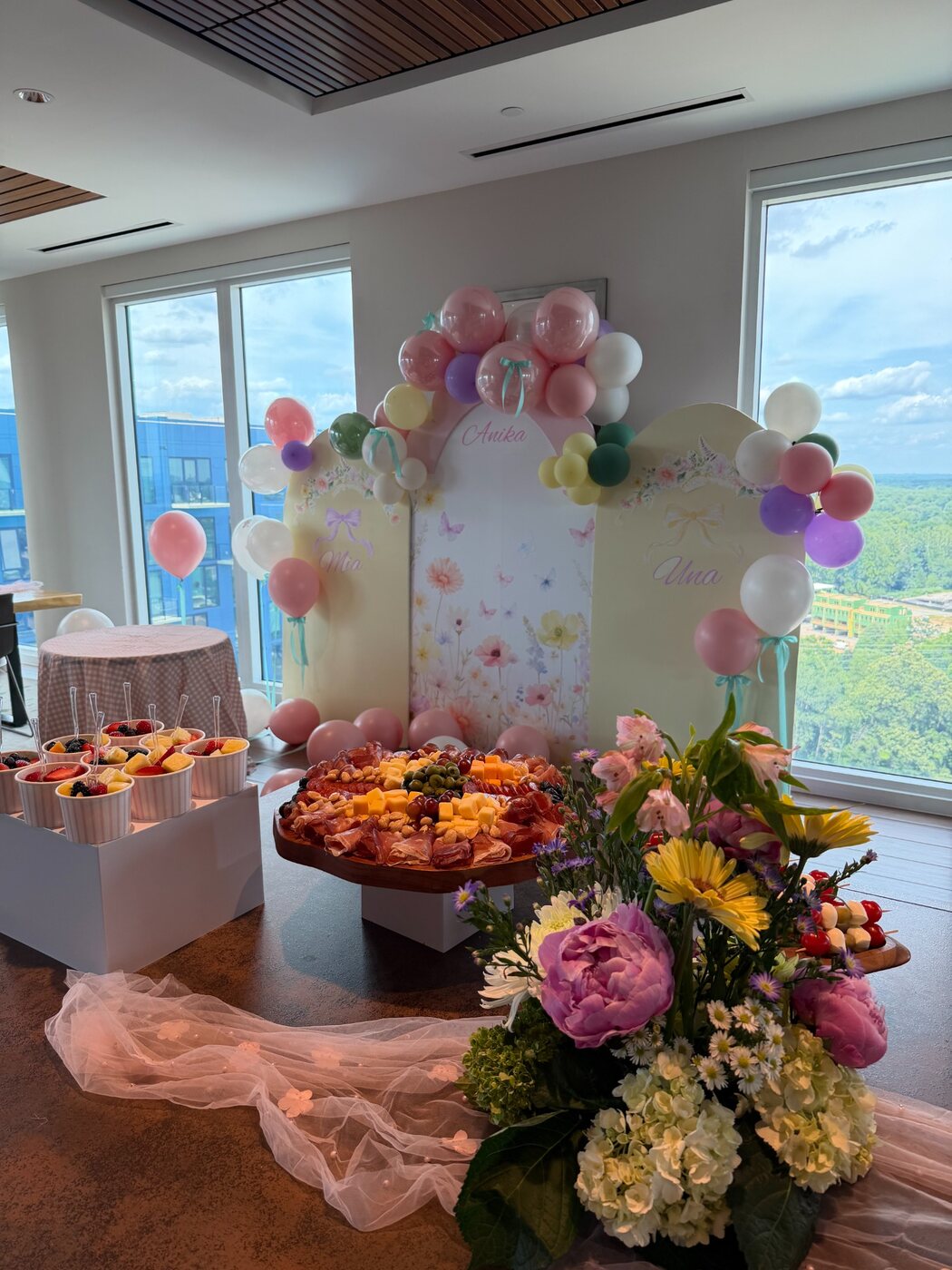 Pink floral and balloon styling for a celebration